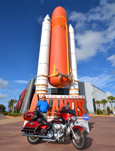 Biker poses with motorcycle in front of KSC